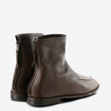 Brown boots, back view