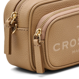 Close up of the brown bag, showing texture of the leather fabric