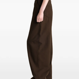 Brown pants worn by a person, showing the pants fit