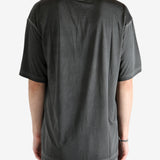 Black t-shirt worn by a person, showing the t-shirt fit