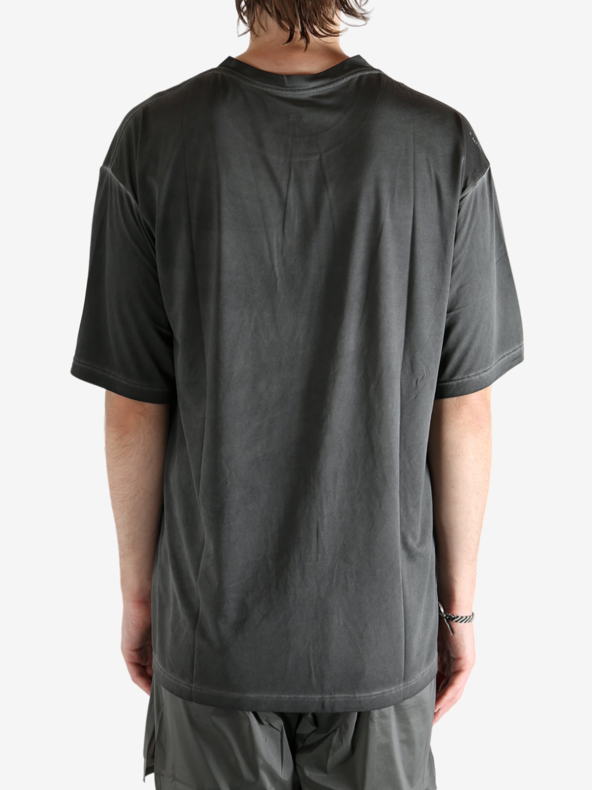 Black t-shirt worn by a person, showing the t-shirt fit