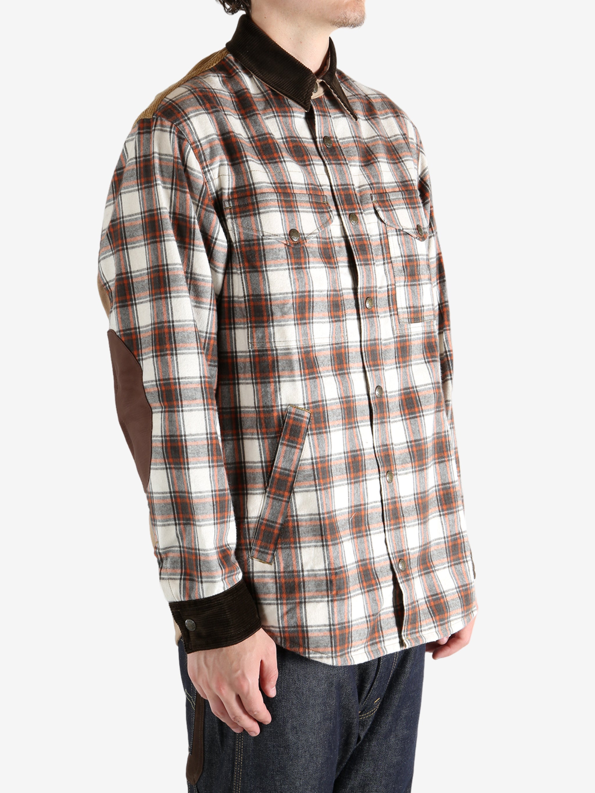 Brown shirt worn by a person, showing the shirt fit