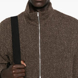 Close up of the brown coat, showing texture of the polyester
and wool fabric