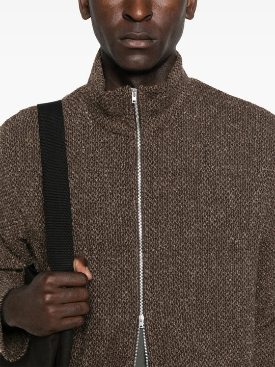 Close up of the brown coat, showing texture of the polyester
and wool fabric