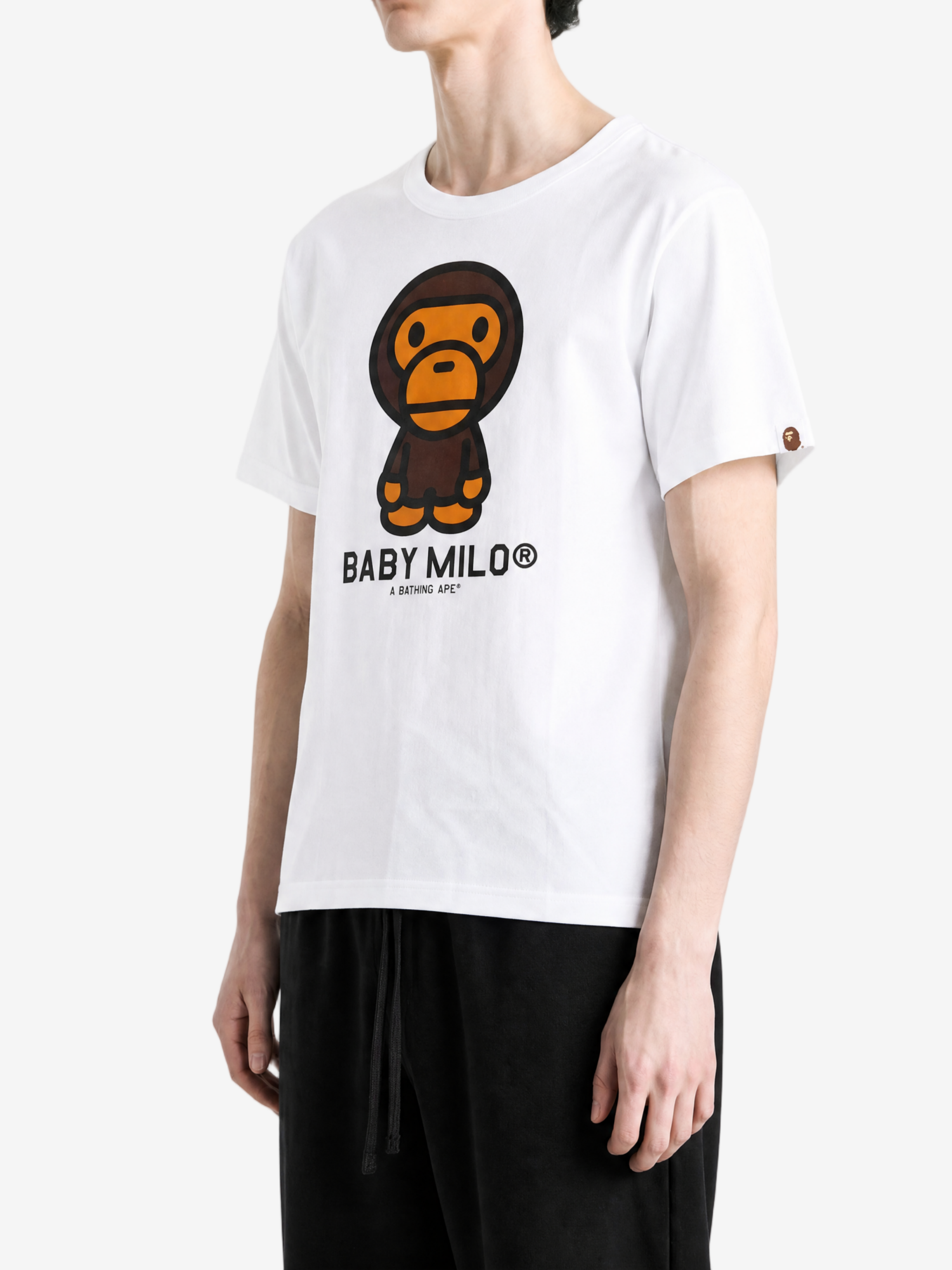 White t-shirt worn by a person, showing the t-shirt fit