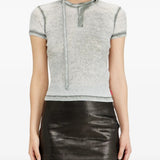 Grey tops worn by a person, showing the top's fit