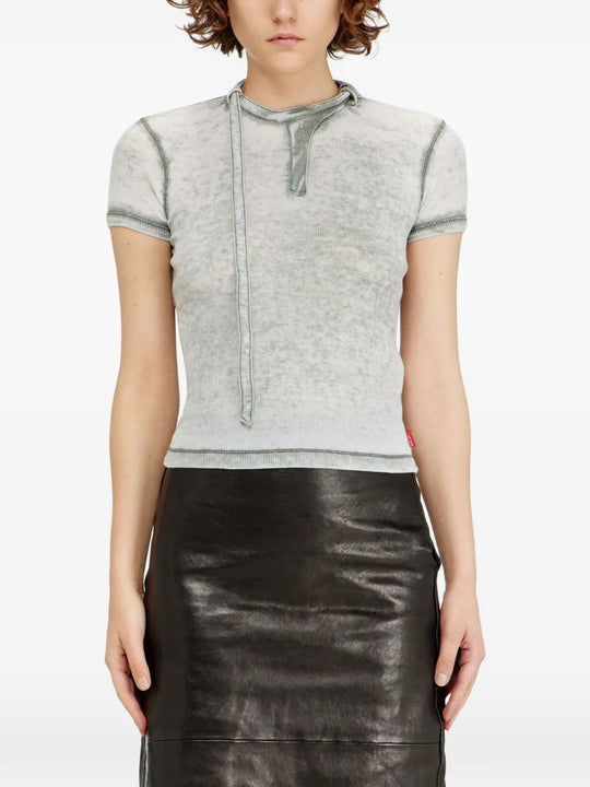 Grey tops worn by a person, showing the top's fit