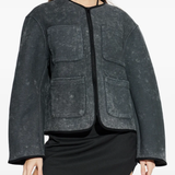 grey jacket worn by a person, showing the jacket fit