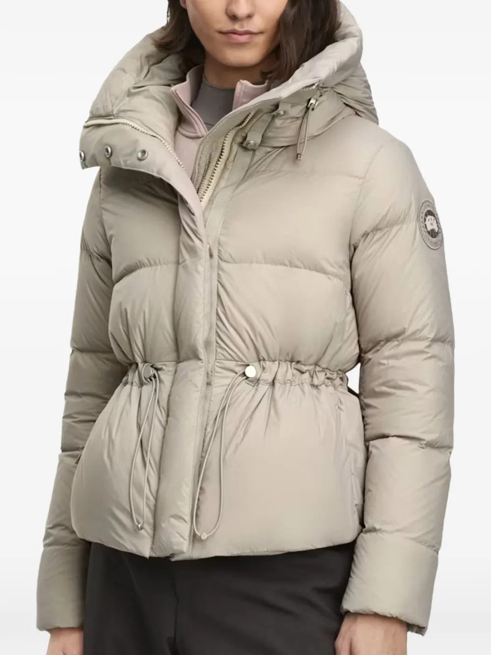 Tan jacket worn by a person, showing the jacket fit