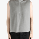 Grey top worn by a person, showing the top's fit