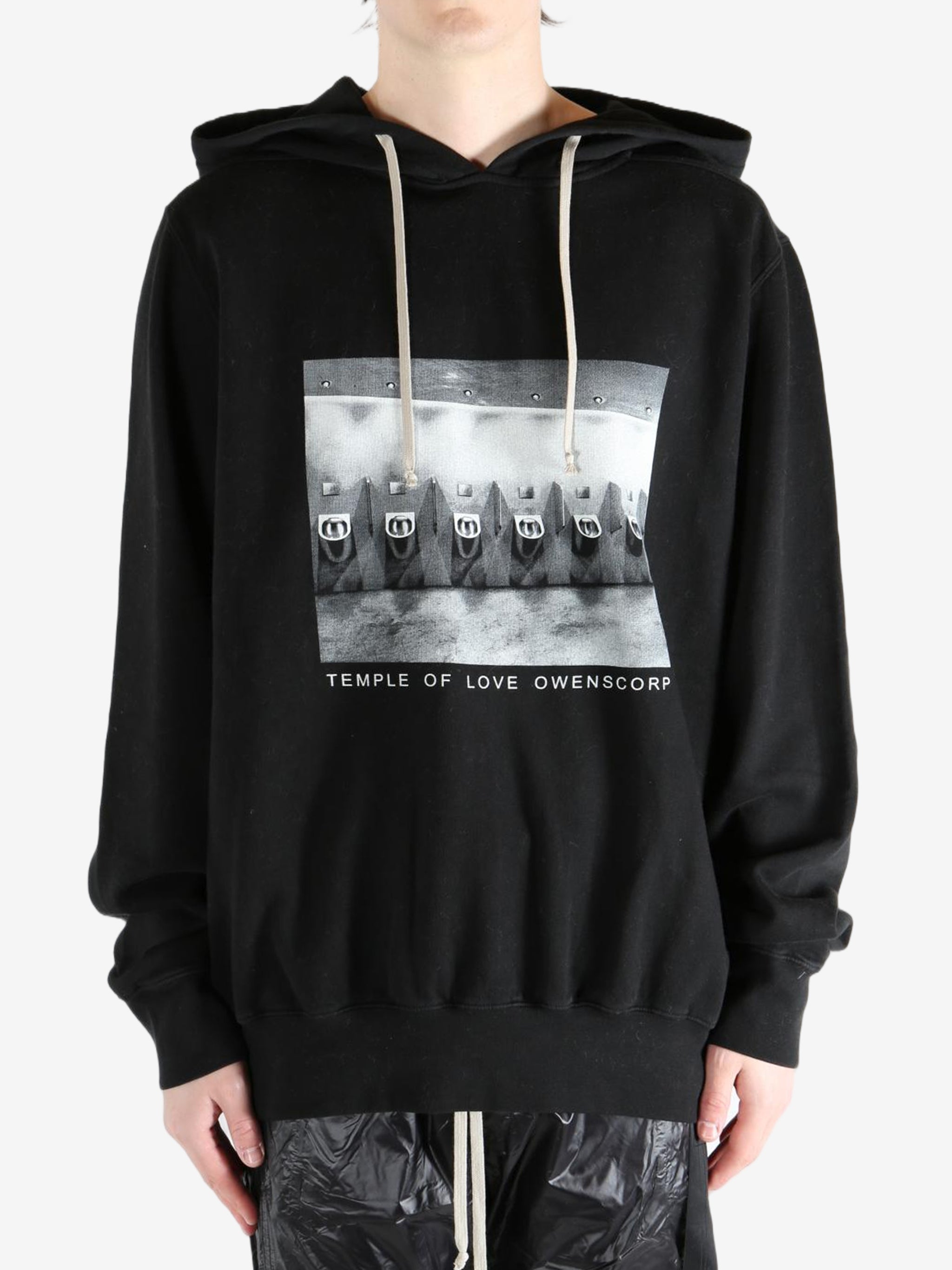 Black hoodie worn by a person, showing the hoodie's fit