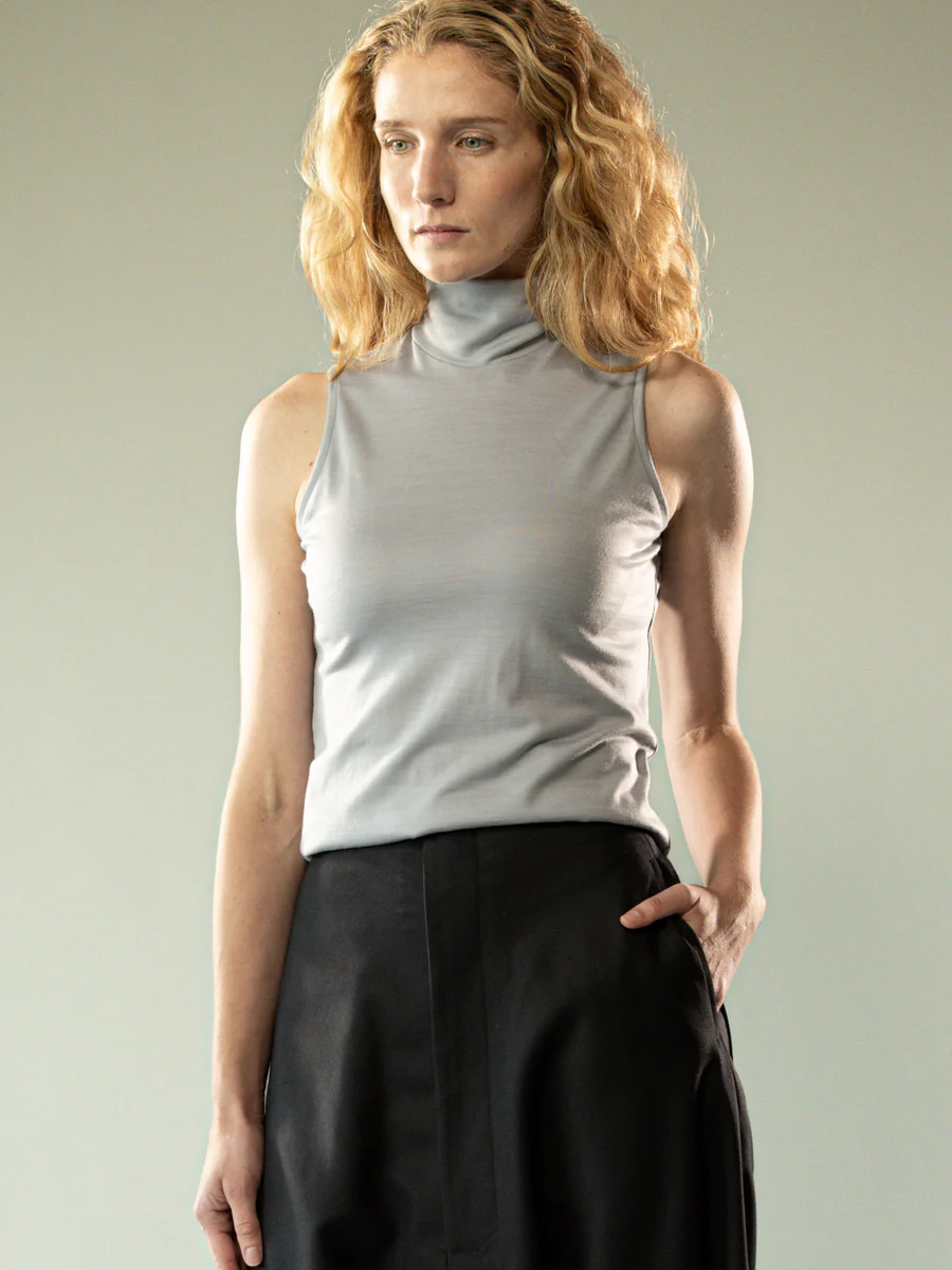 Grey top worn by a person, showing the top's fit