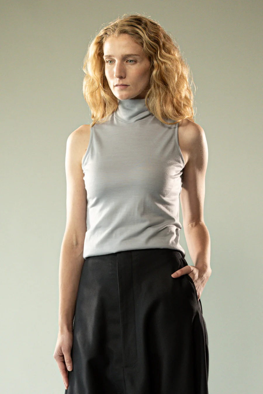 Grey top worn by a person, showing the top's fit