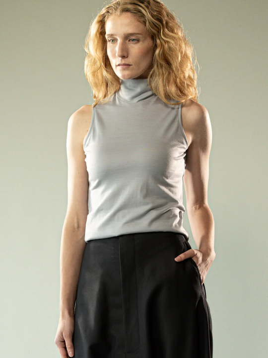 Grey top worn by a person, showing the top's fit