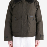 Brown jacket worn by a person, showing the jacket fit