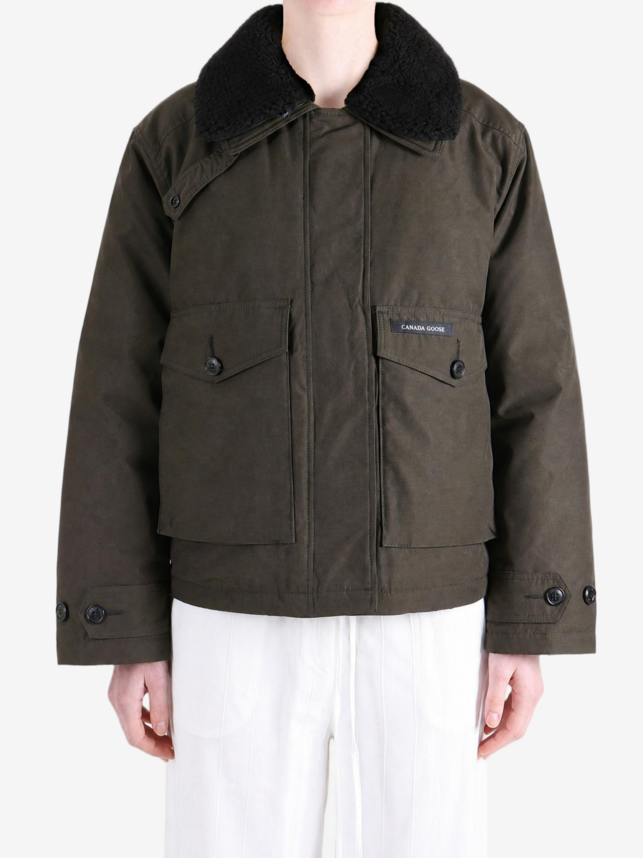 Brown jacket worn by a person, showing the jacket fit