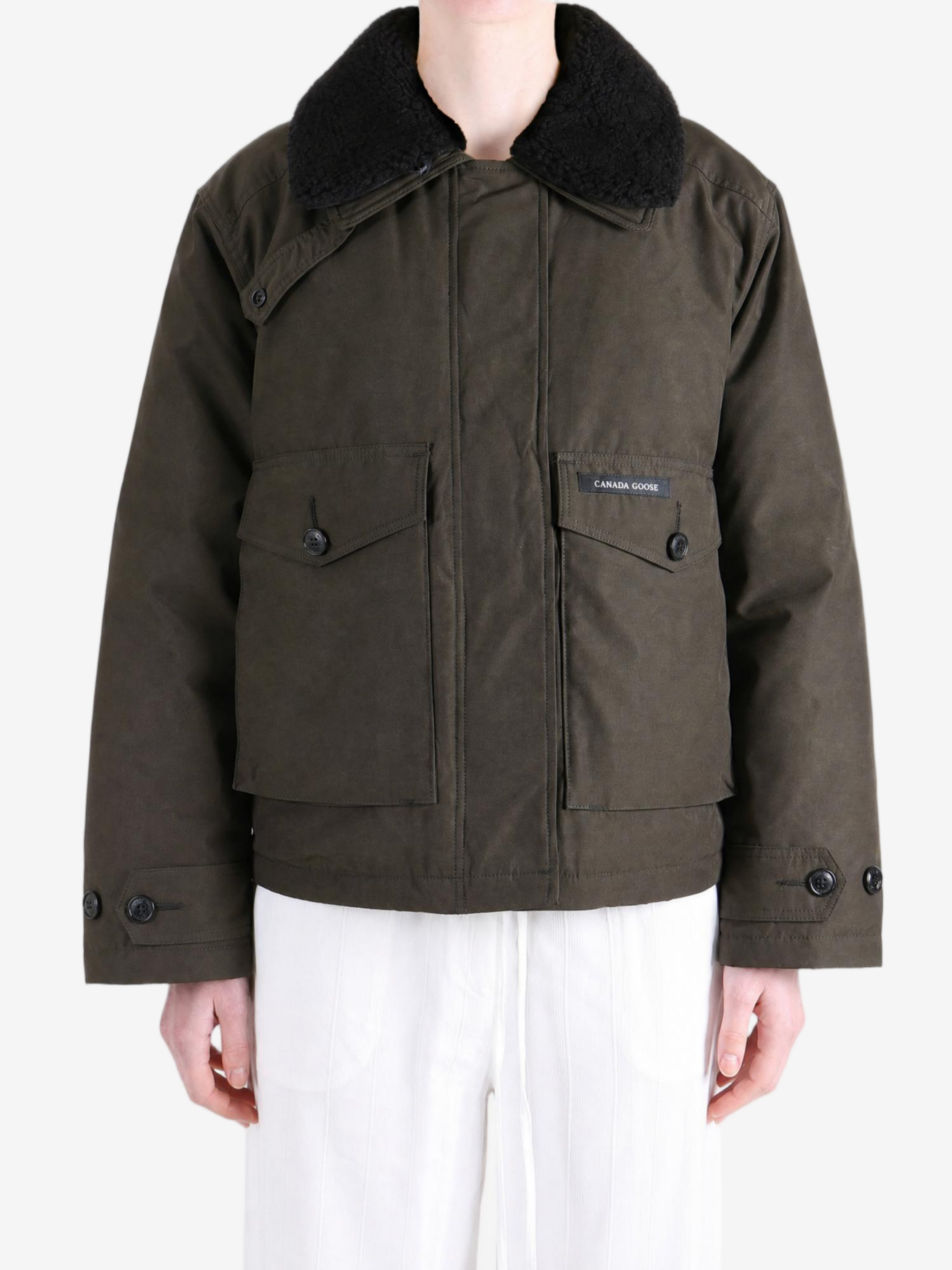 Brown jacket worn by a person, showing the jacket fit