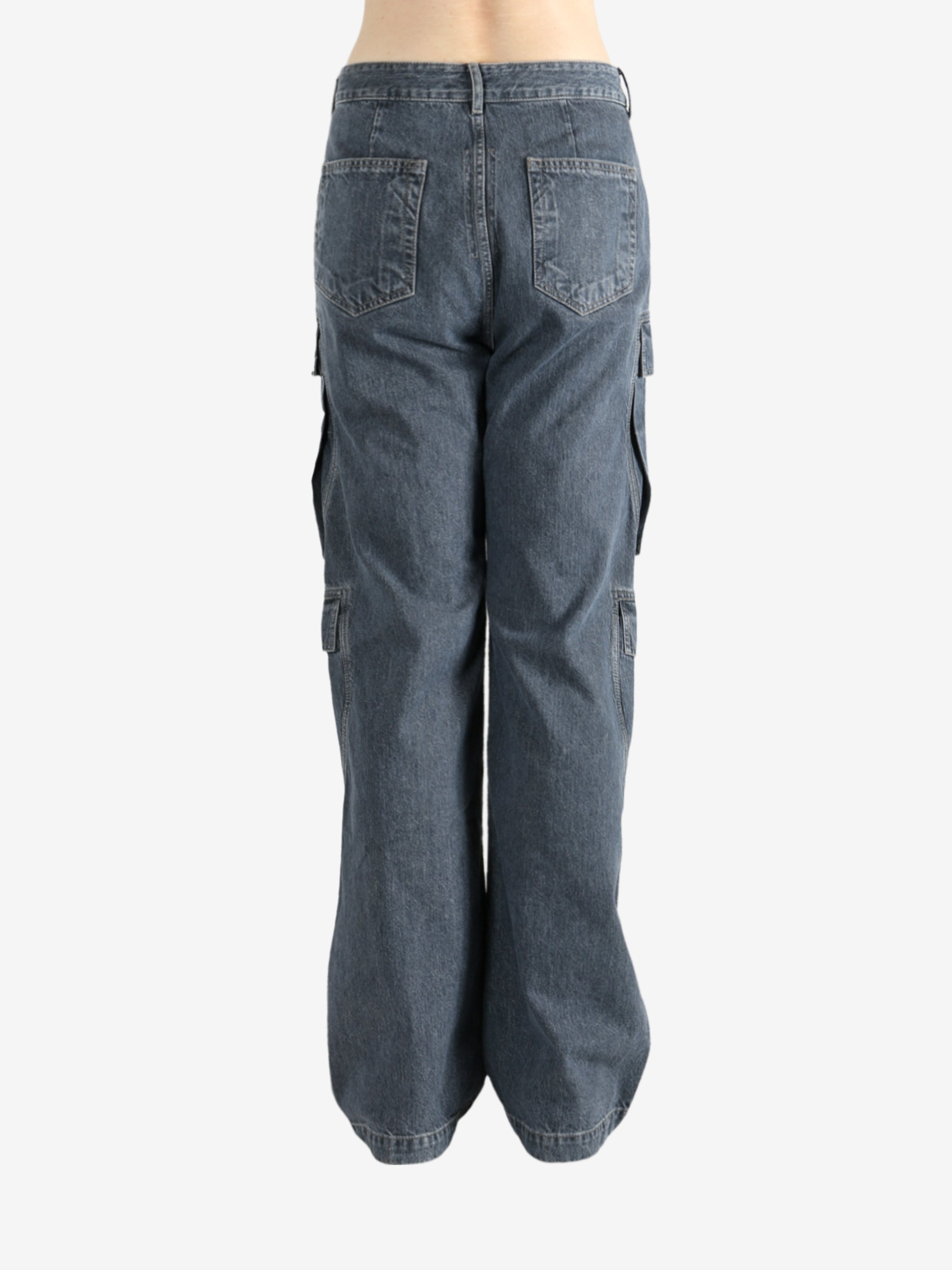 Grey jeans worn by a person, showing the jeans' fit