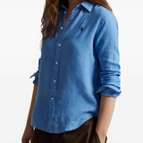 Blue shirt worn by a person, showing the shirt's fit