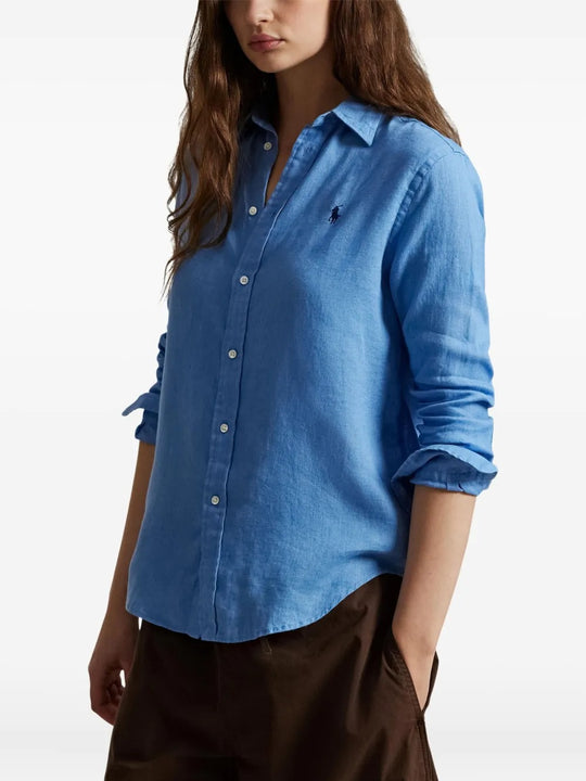 Blue shirt worn by a person, showing the shirt's fit