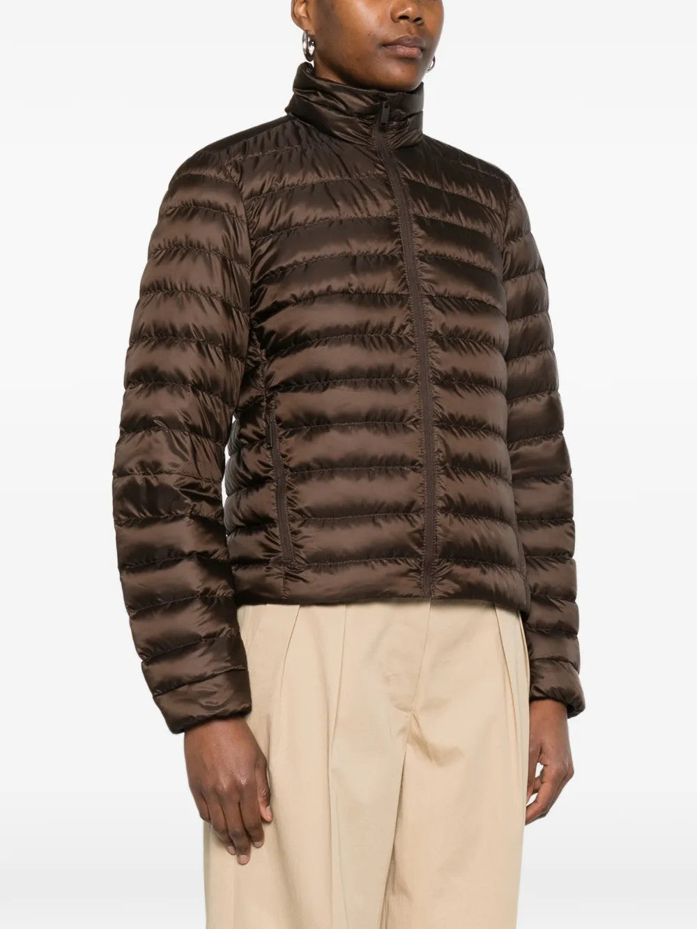 Brown jacket worn by a person, showing the jacket fit