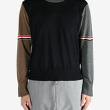 Blue knitwear worn by a person, showing the knitwear fit