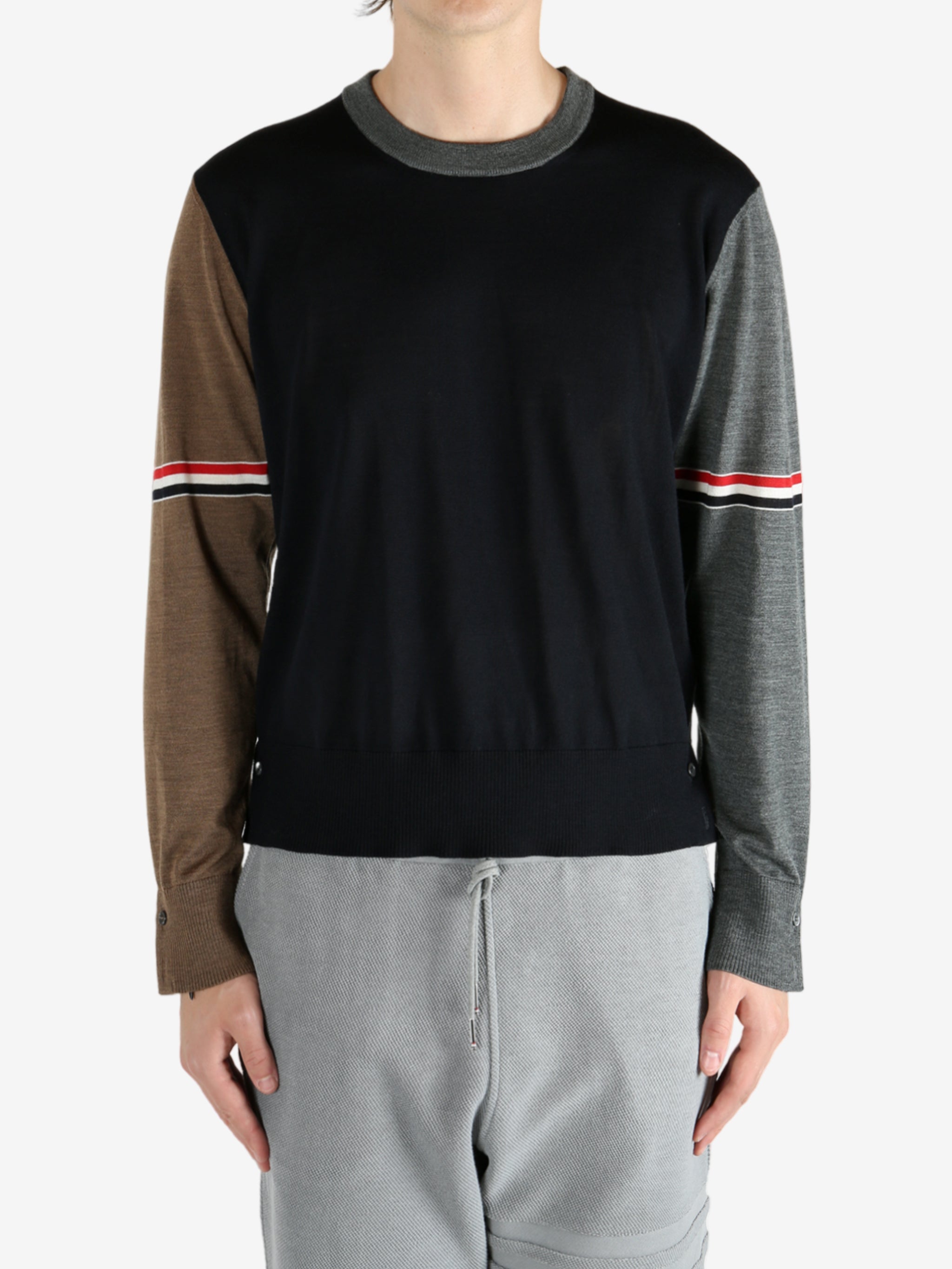 Blue knitwear worn by a person, showing the knitwear fit