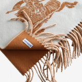 Close up of the white scarf, showing texture of the wool fabric