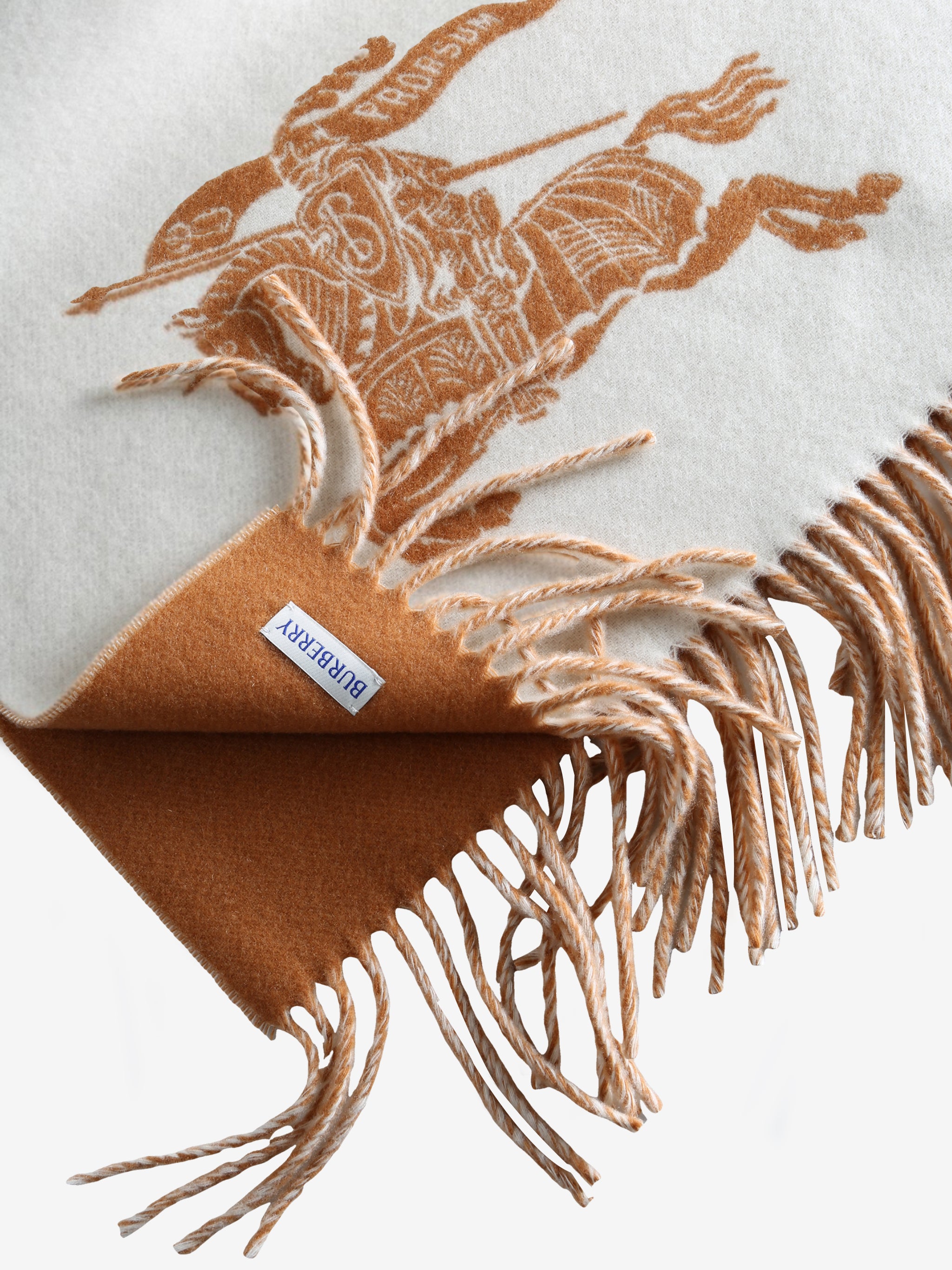 Close up of the white scarf, showing texture of the wool fabric