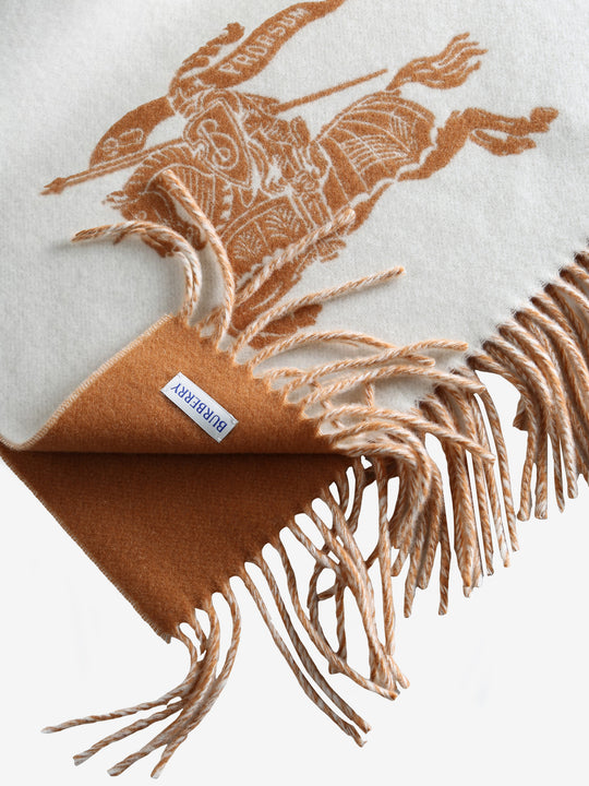 Close up of the white scarf, showing texture of the wool fabric