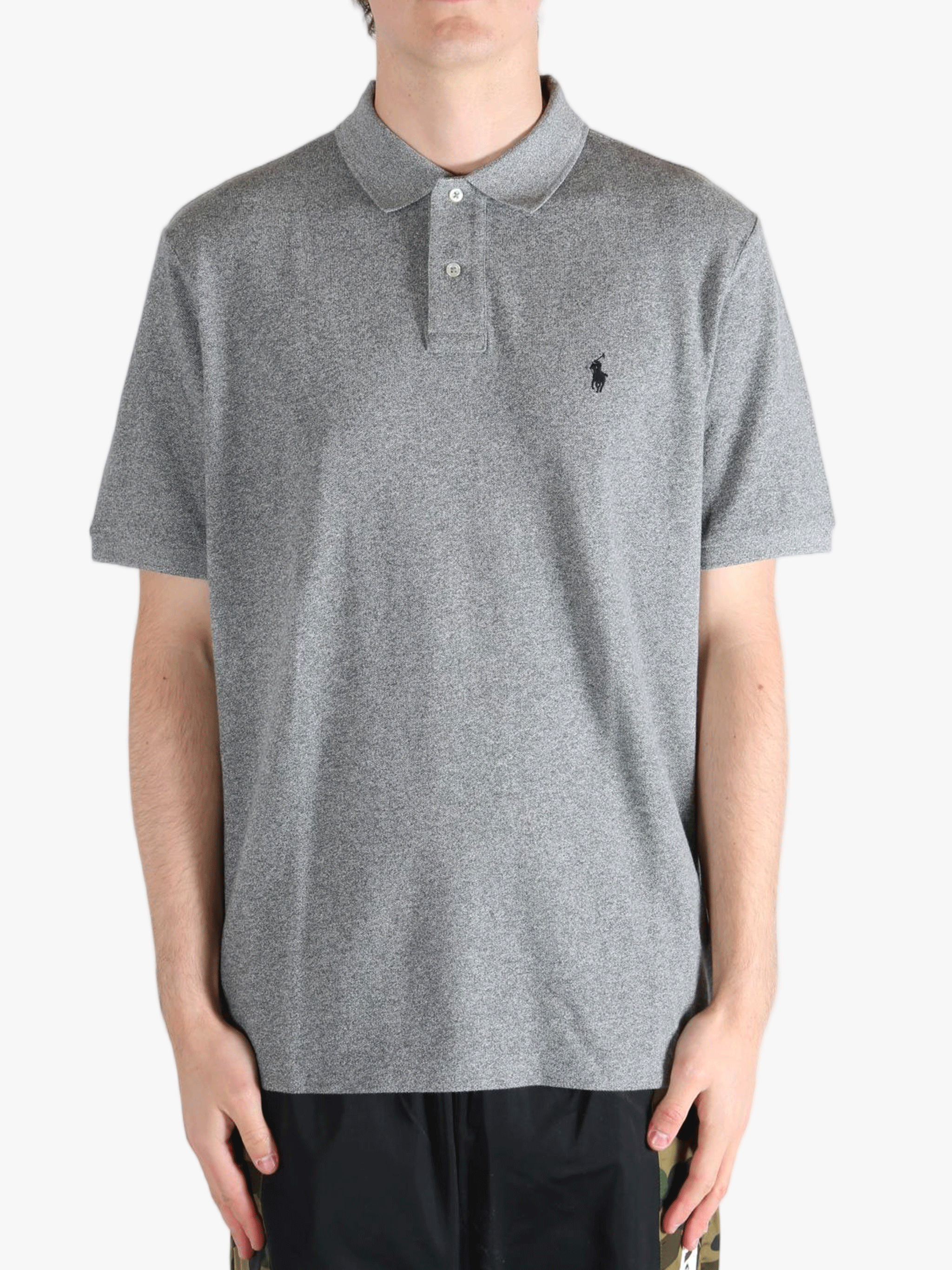 Grey t-shirt worn by a person, showing the t-shirt's fit