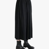 Black skirt worn by a person,showing the skirt fit