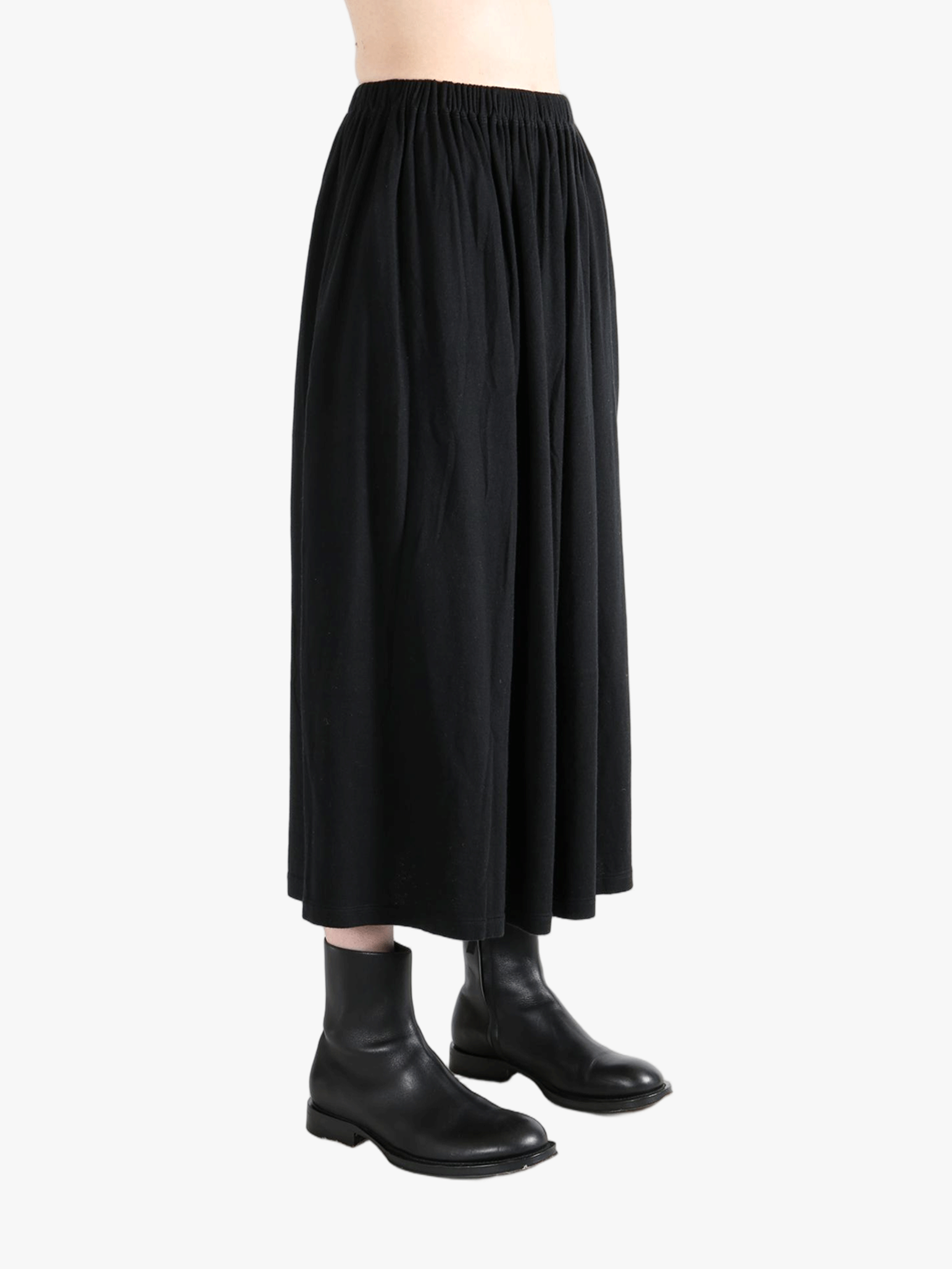 Black skirt worn by a person,showing the skirt fit