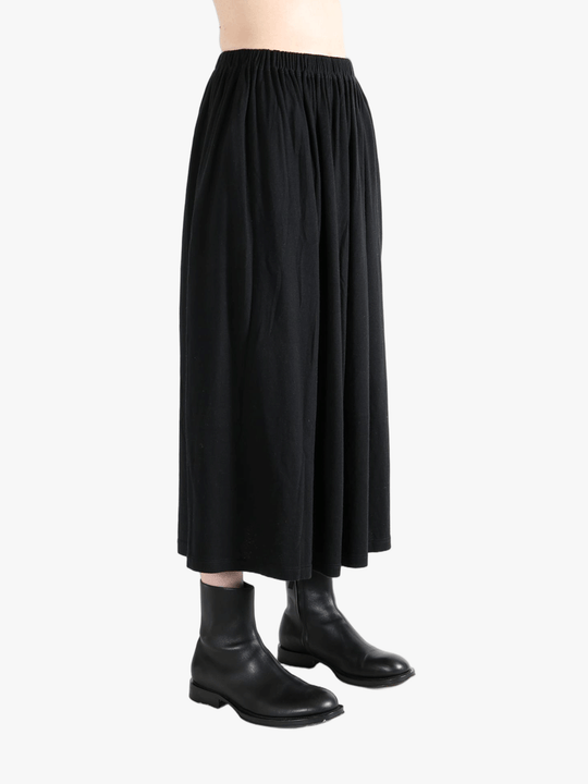 Black skirt worn by a person,showing the skirt fit