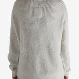 White top worn by a person, showing the top fit