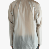 Grey shirt worn by a person, showing the shirt's fit