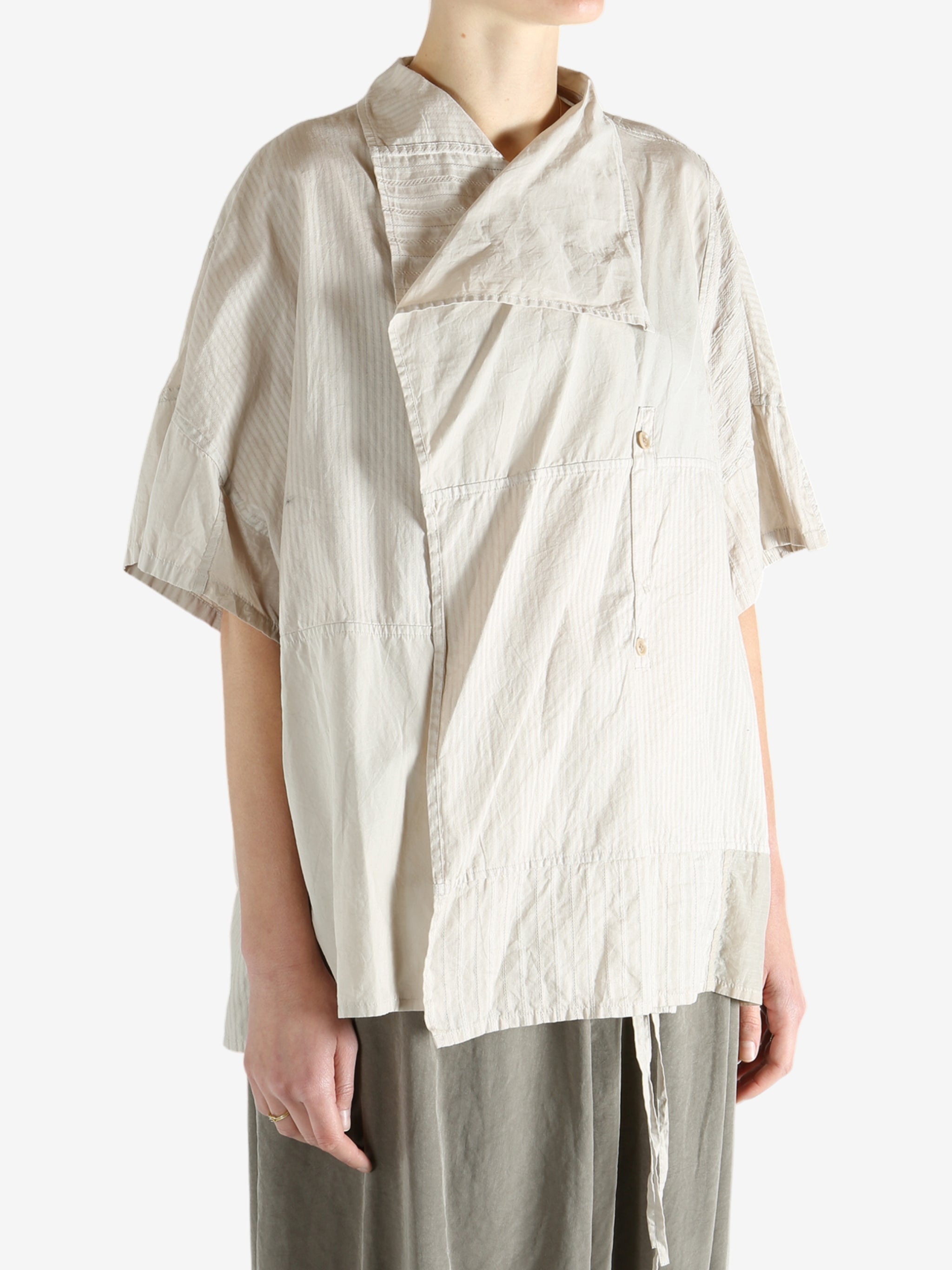 White shirts worn by a person, showing the shirts fit