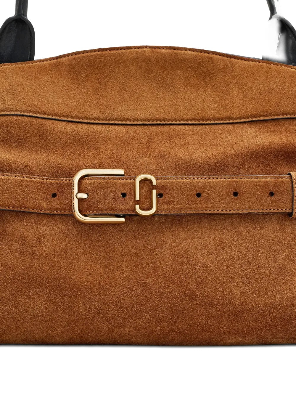 Close up of the brown bag, showing texture of the leather fabric