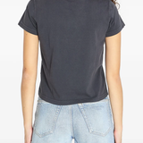 black t-shirt worn by a person, showing the t-shirt fit