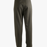 Brown pants worn by a person, showing the pants's fit