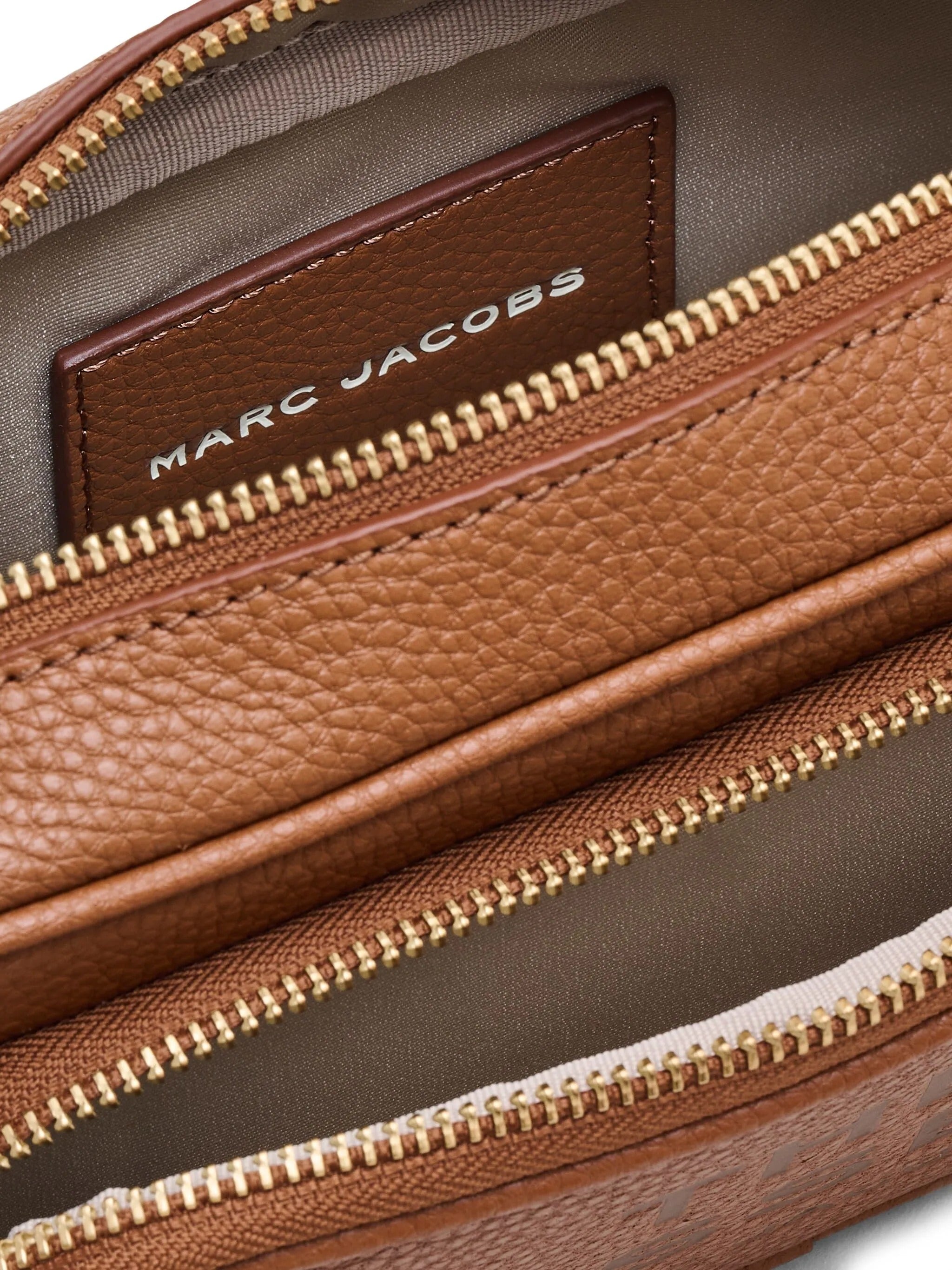 Close up of brown bag, showing texture of the leather fabric