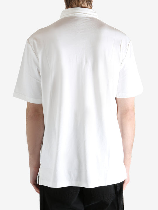 White t-shirt worn by a person, showing the shirt's fit