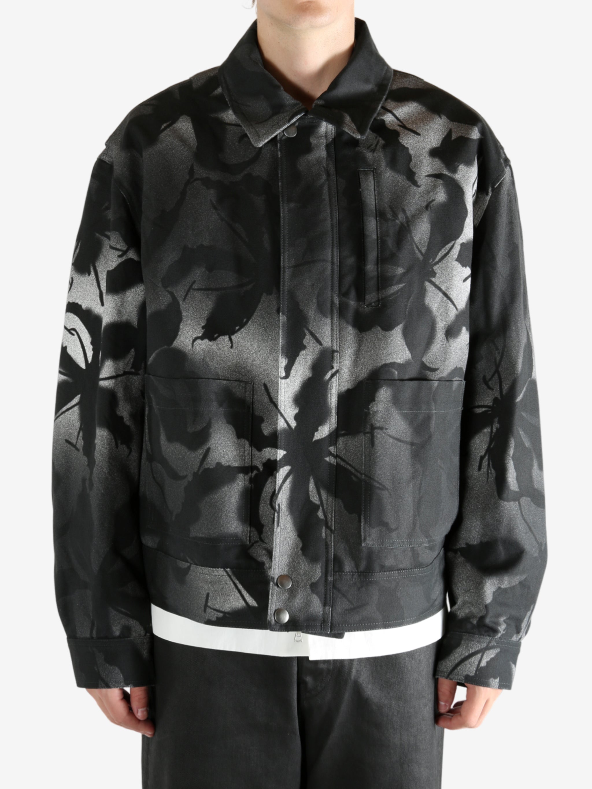 Black jacket worn by a person, showing the jacket's fit