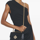 Black bag worn by a person, showing the bag's fit 