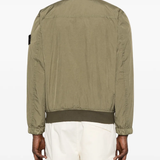 Green jackets worn by a person, showing the jackets fit