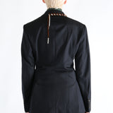 Navy coat worn by a person, showing the coat's fit