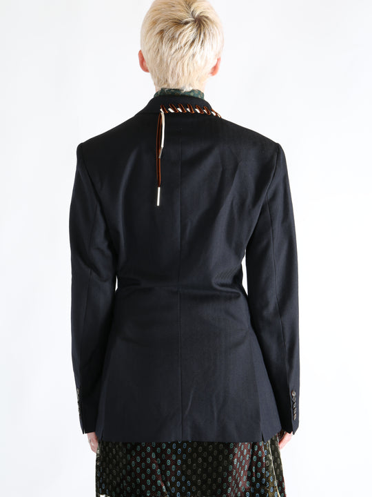 Navy coat worn by a person, showing the coat's fit
