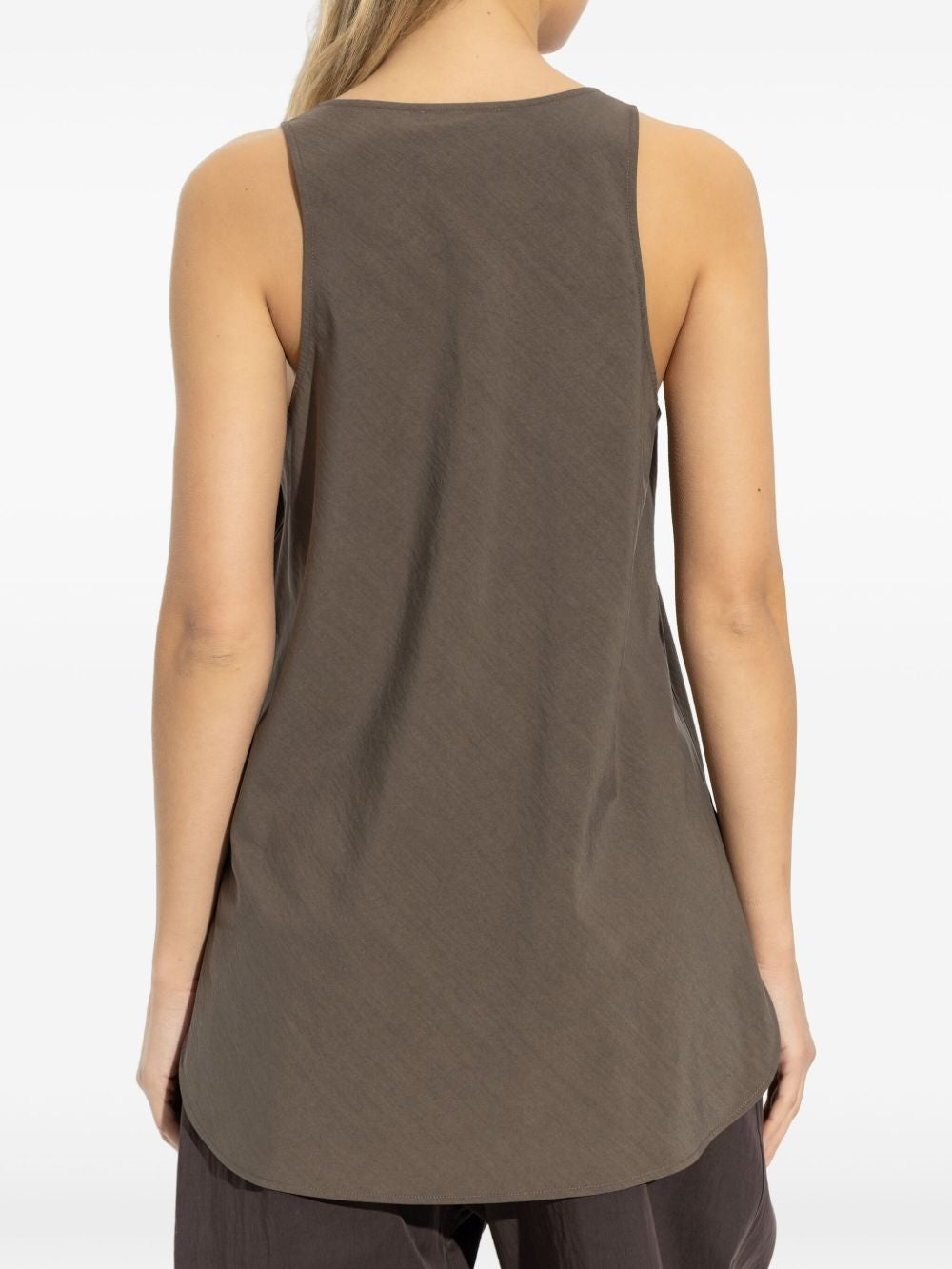 Brown top worn by a person, showing the top fit
