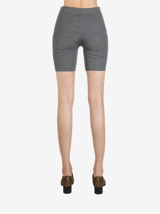 Grey pant worn by a person, showing the pant's fit