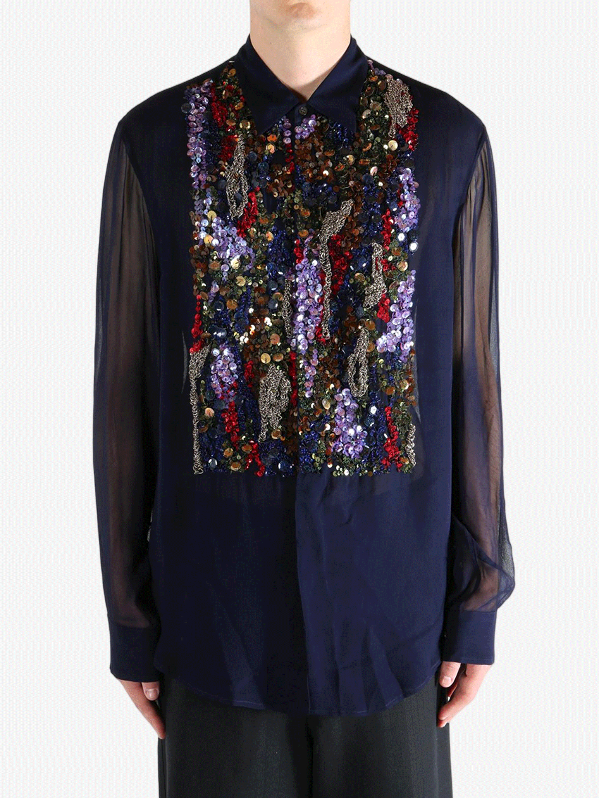 Navy blue shirt worn by a person, showing the shirt's fit